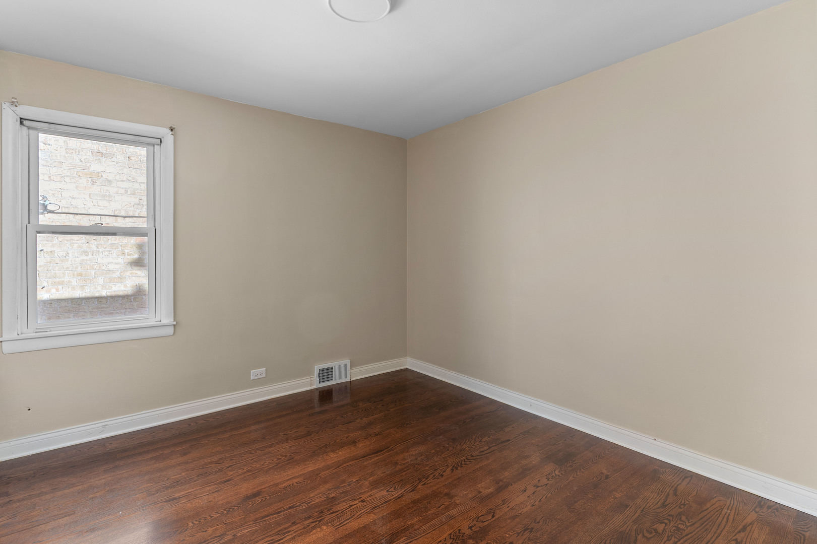 5345 North Neva Avenue Chicago, IL 60656 - Photo 11 of 32 wooden floor in an empty room with a window