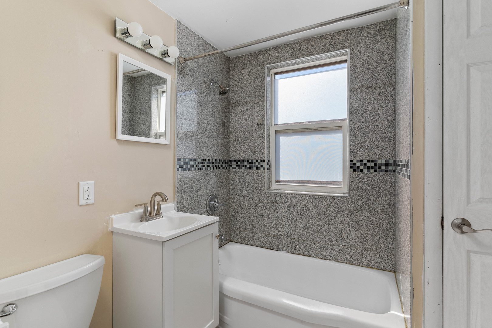 5345 North Neva Avenue Chicago, IL 60656 - Photo 22 of 32 a bath room with a toilet a sink and a bath tub