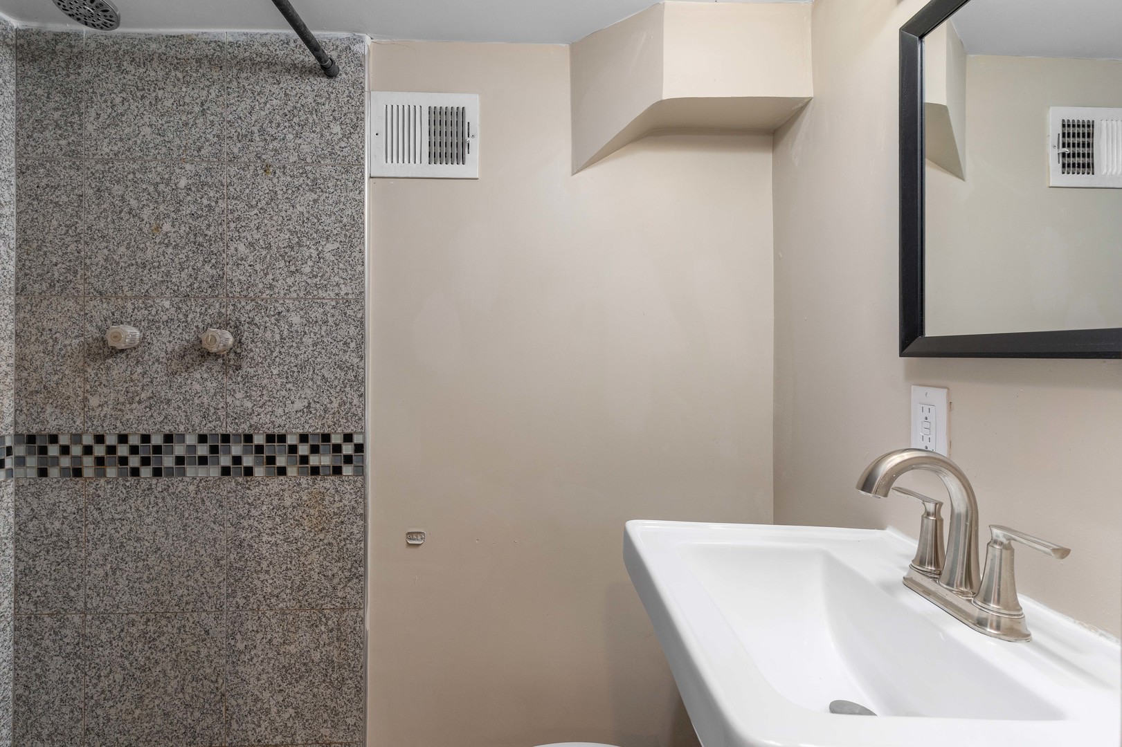 5345 North Neva Avenue Chicago, IL 60656 - Photo 26 of 32 a bathroom with a sink and a mirror