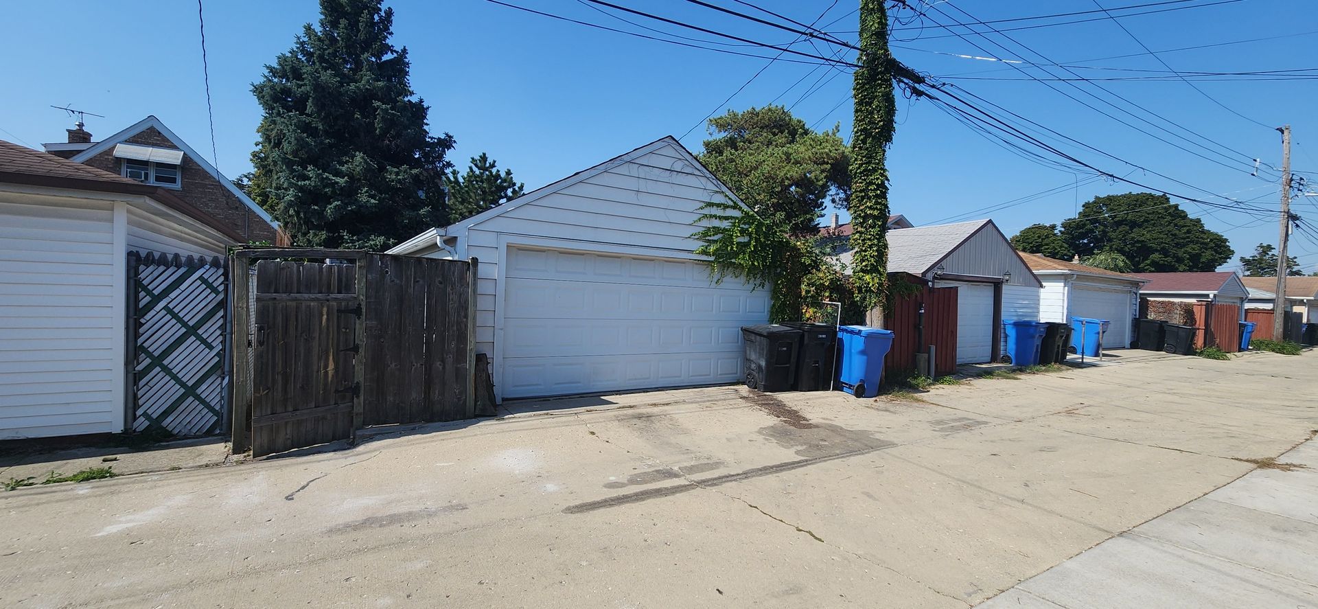 5345 North Neva Avenue Chicago, IL 60656 - Photo 32 of 32 a view of a house with a yard and potted plants