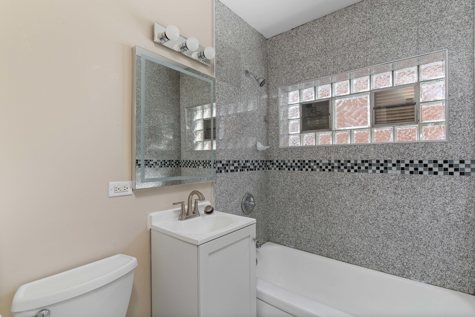 5345 North Neva Avenue Chicago, IL 60656 - Photo 10 of 32 a bathroom with a sink and a toilet