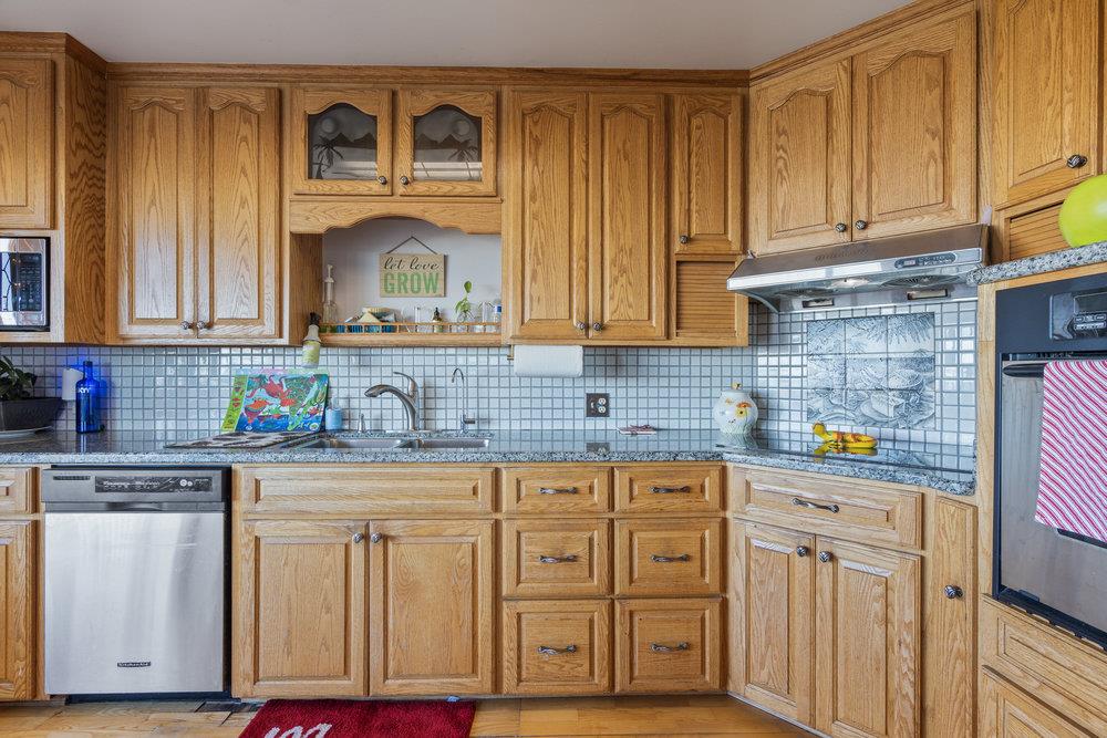 380 Hillside Road San Juan Bautista, CA 95045 - Photo 15 of 60 a kitchen with cabinets appliances and a counter space