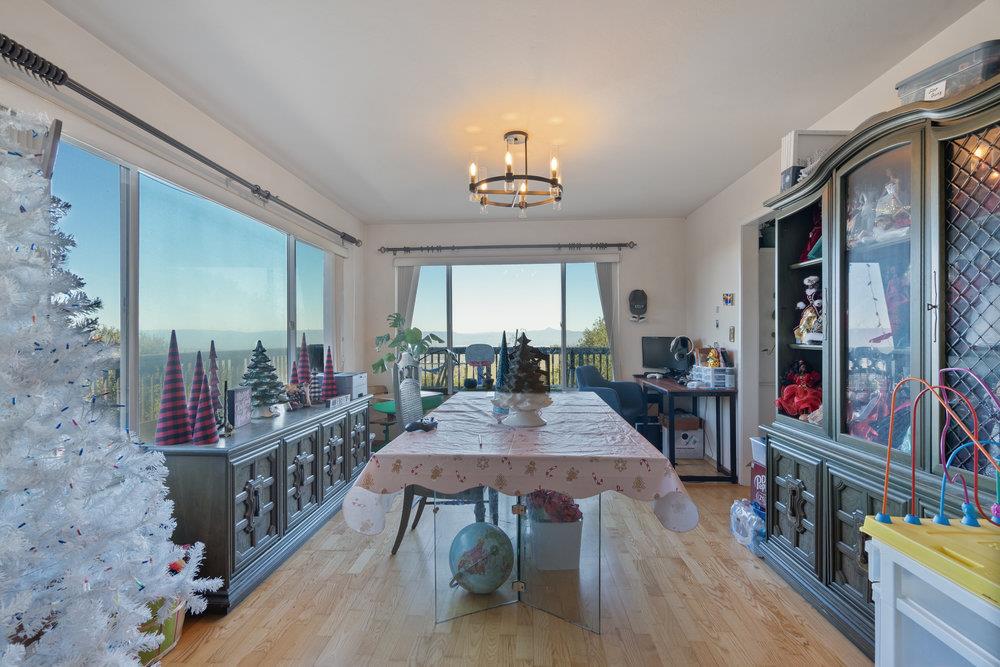 380 Hillside Road San Juan Bautista, CA 95045 - Photo 16 of 60 a view of a dining room with furniture window and wooden floor
