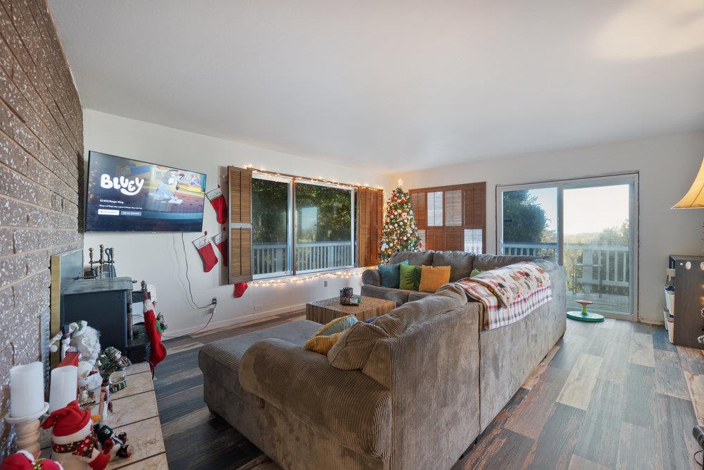 380 Hillside Road San Juan Bautista, CA 95045 - Photo 19 of 60 a living room with furniture large window and flat screen tv