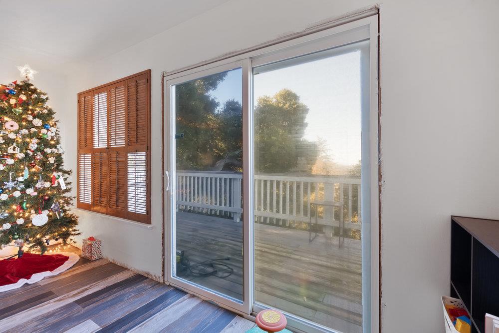 380 Hillside Road San Juan Bautista, CA 95045 - Photo 20 of 60 a view of a room that has a large window and wooden floor