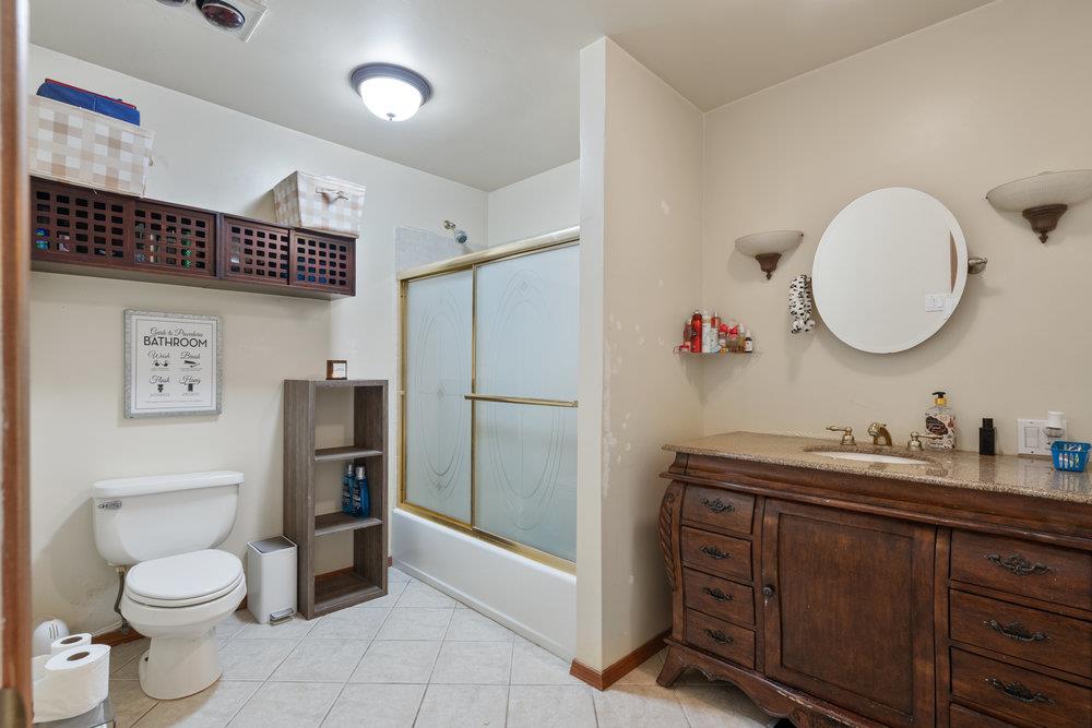 380 Hillside Road San Juan Bautista, CA 95045 - Photo 28 of 60 a bathroom with a toilet sink and a mirror