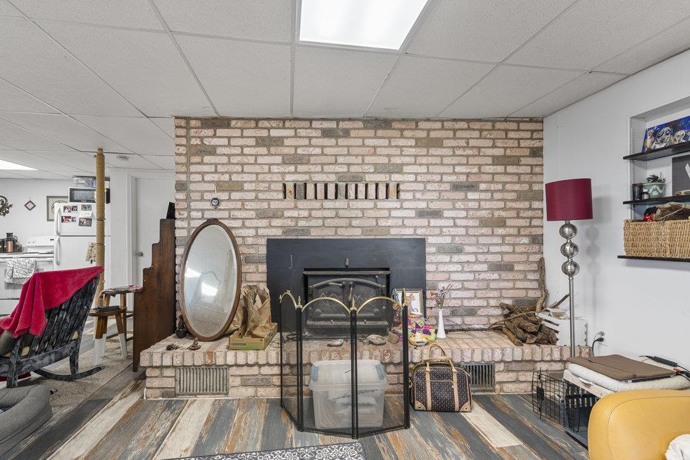 380 Hillside Road San Juan Bautista, CA 95045 - Photo 38 of 60 a living room with furniture and a fireplace