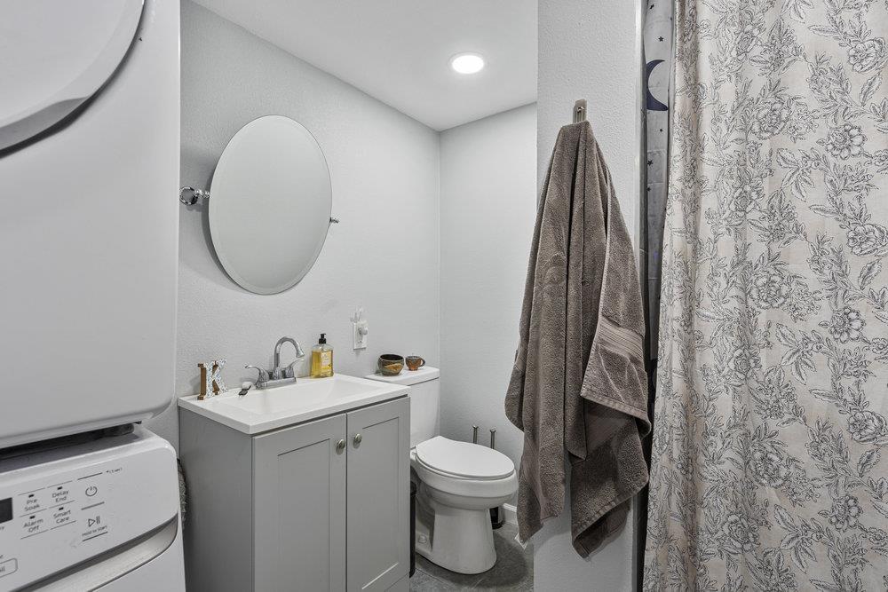 380 Hillside Road San Juan Bautista, CA 95045 - Photo 42 of 60 a bathroom with a toilet sink and mirror