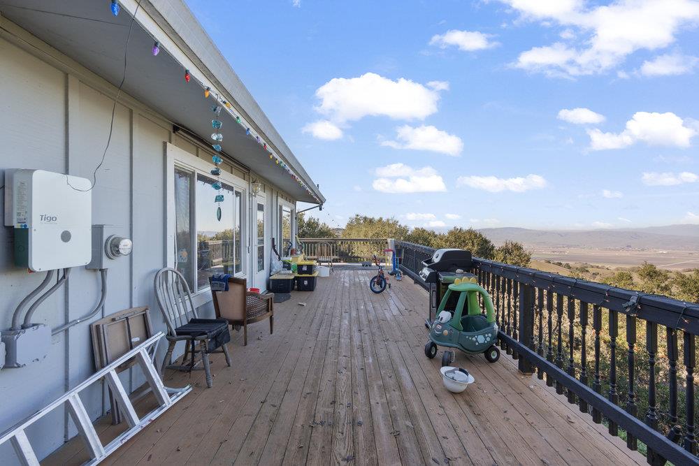 380 Hillside Road San Juan Bautista, CA 95045 - Photo 50 of 60 a view of a balcony with chairs and wooden floor