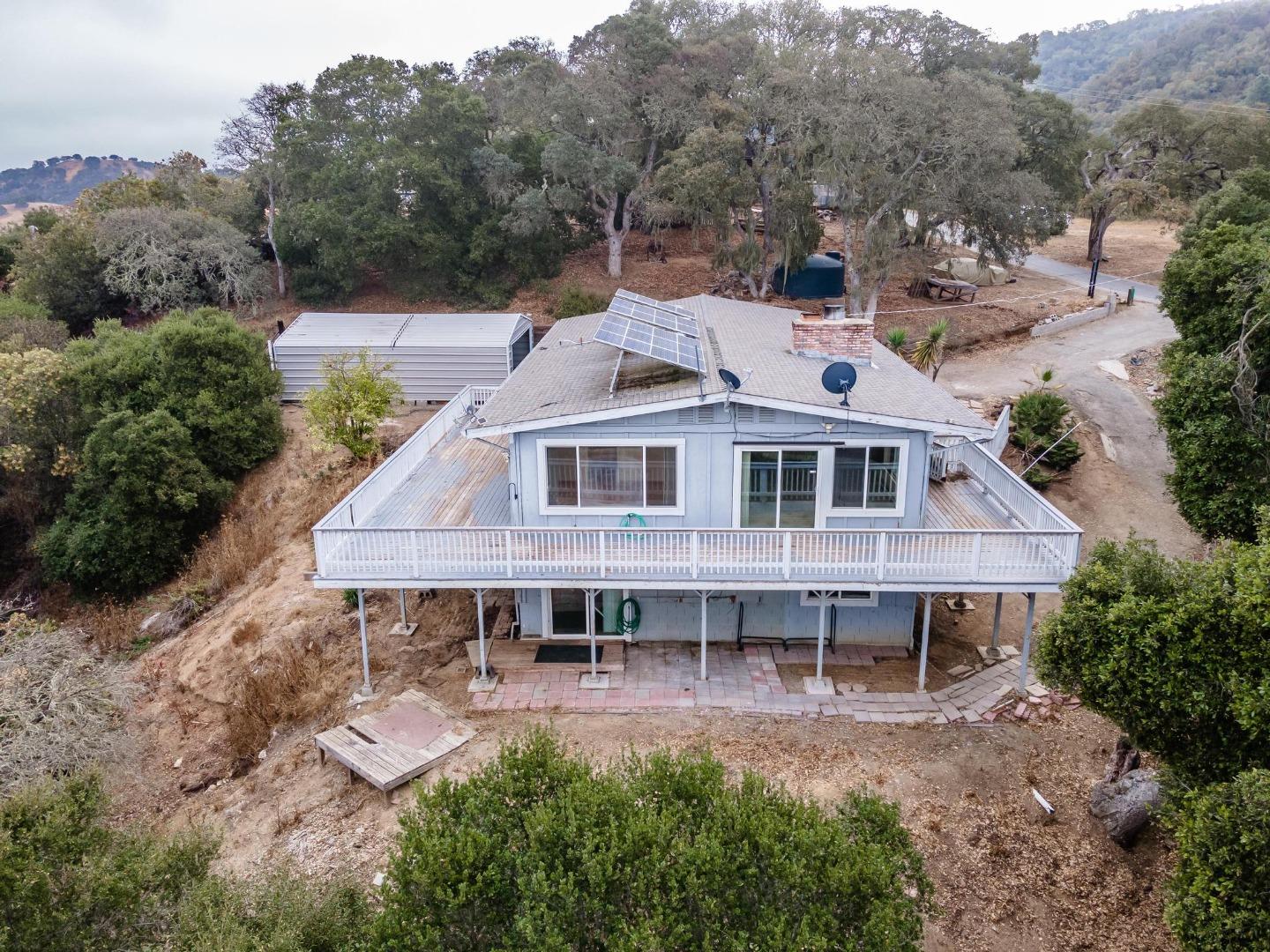 380 Hillside Road San Juan Bautista, CA 95045 - Photo 7 of 60 a aerial view of a house with a yard table and chairs