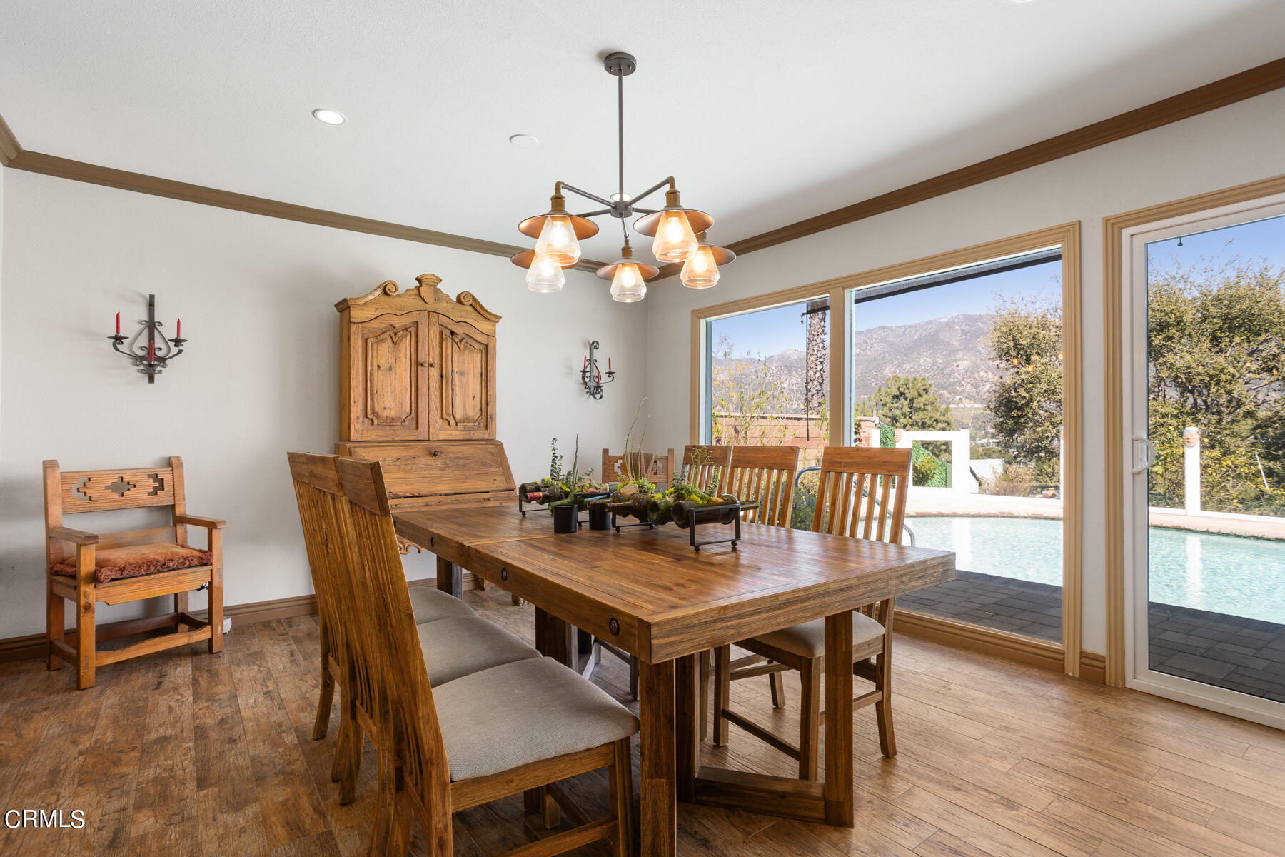 9400 Crystal View Drive Tujunga, CA 91042 - Photo 24 of 67 a dining room with furniture a chandelier and wooden floor