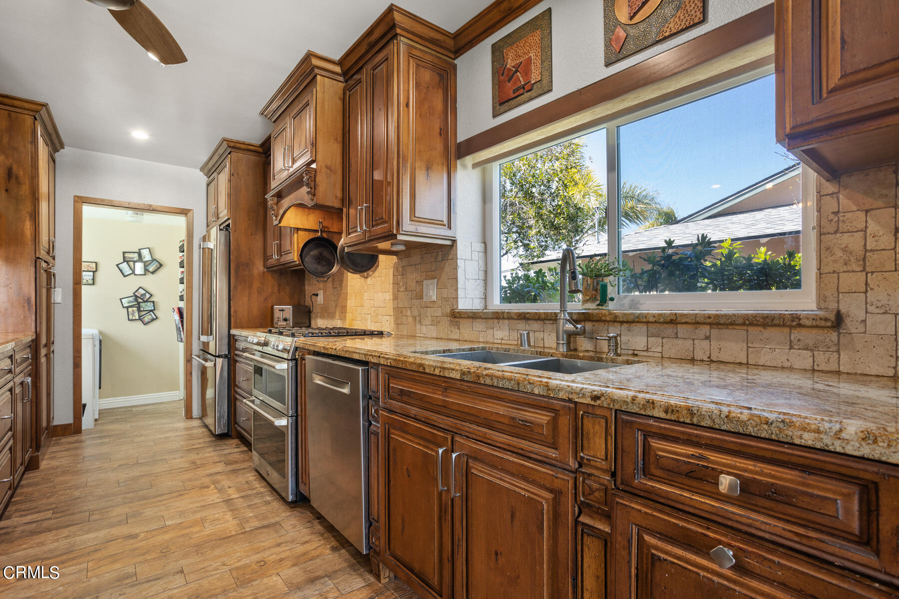 9400 Crystal View Drive Tujunga, CA 91042 - Photo 26 of 67 a kitchen with stainless steel appliances granite countertop a sink and a stove