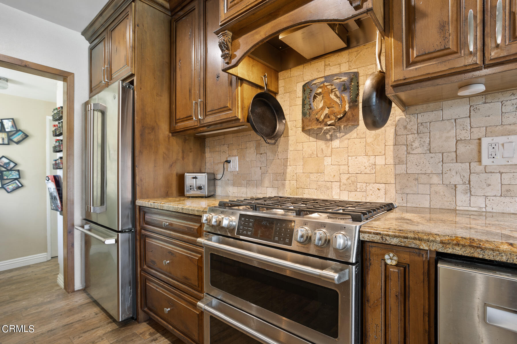 9400 Crystal View Drive Tujunga, CA 91042 - Photo 27 of 67 a kitchen with stainless steel appliances granite countertop a stove and a refrigerator