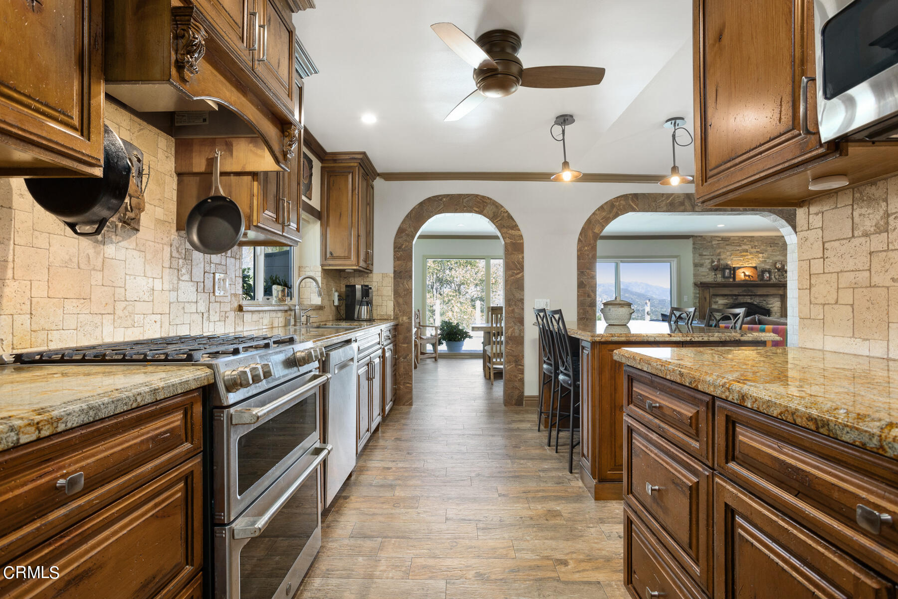 9400 Crystal View Drive Tujunga, CA 91042 - Photo 29 of 67 a kitchen with stainless steel appliances granite countertop a stove and a sink