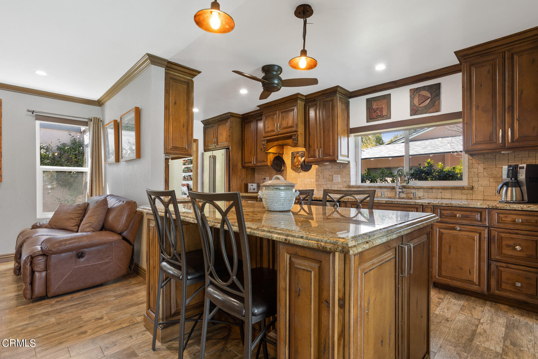 9400 Crystal View Drive Tujunga, CA 91042 - Photo 31 of 67 a kitchen with stainless steel appliances granite countertop a sink and a refrigerator