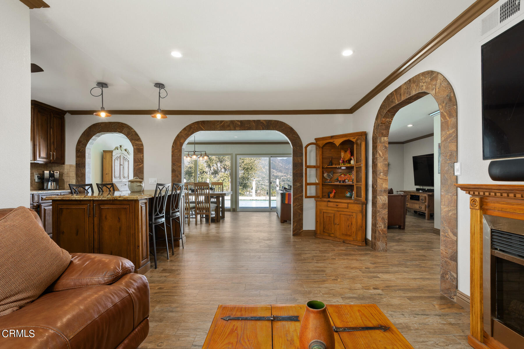 9400 Crystal View Drive Tujunga, CA 91042 - Photo 38 of 67 a living room with fireplace furniture and a wooden floor