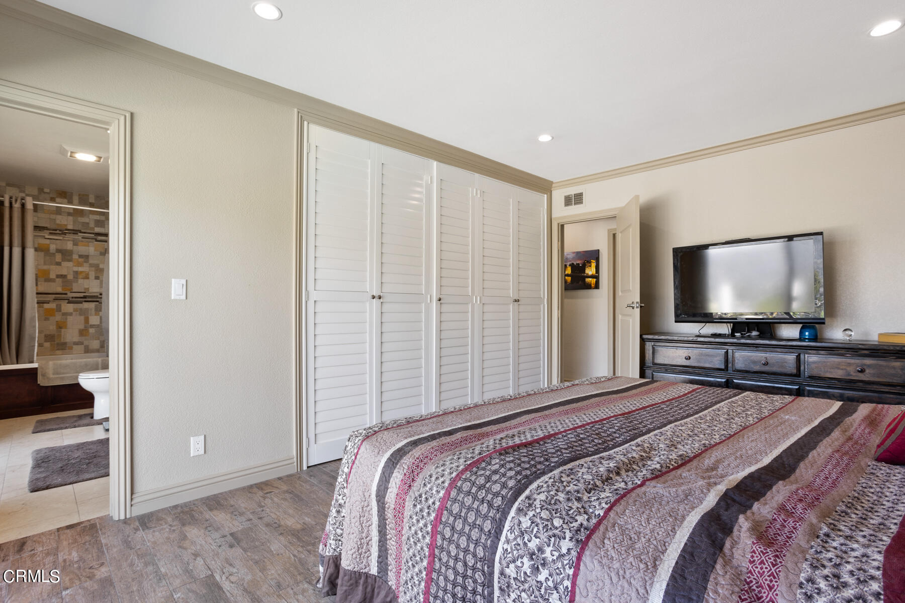 9400 Crystal View Drive Tujunga, CA 91042 - Photo 43 of 67 a bedroom with a bed and a flat screen tv