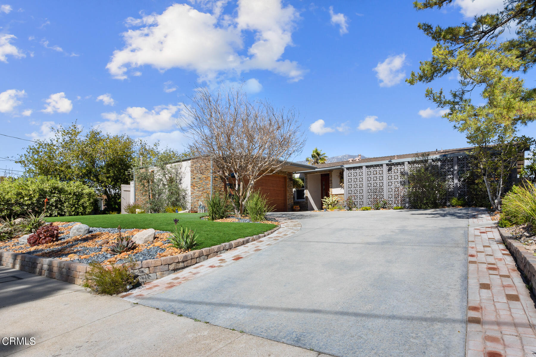 9400 Crystal View Drive Tujunga, CA 91042 - Photo 10 of 67 a front view of a house with a yard and garden