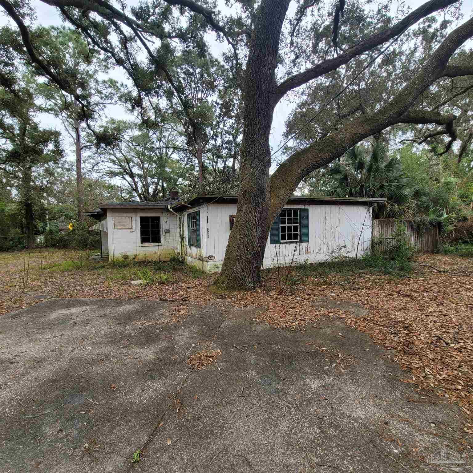 635 Edgewater Drive Pensacola, FL 32507 - Photo 2 of 9 a view of a house with a tree