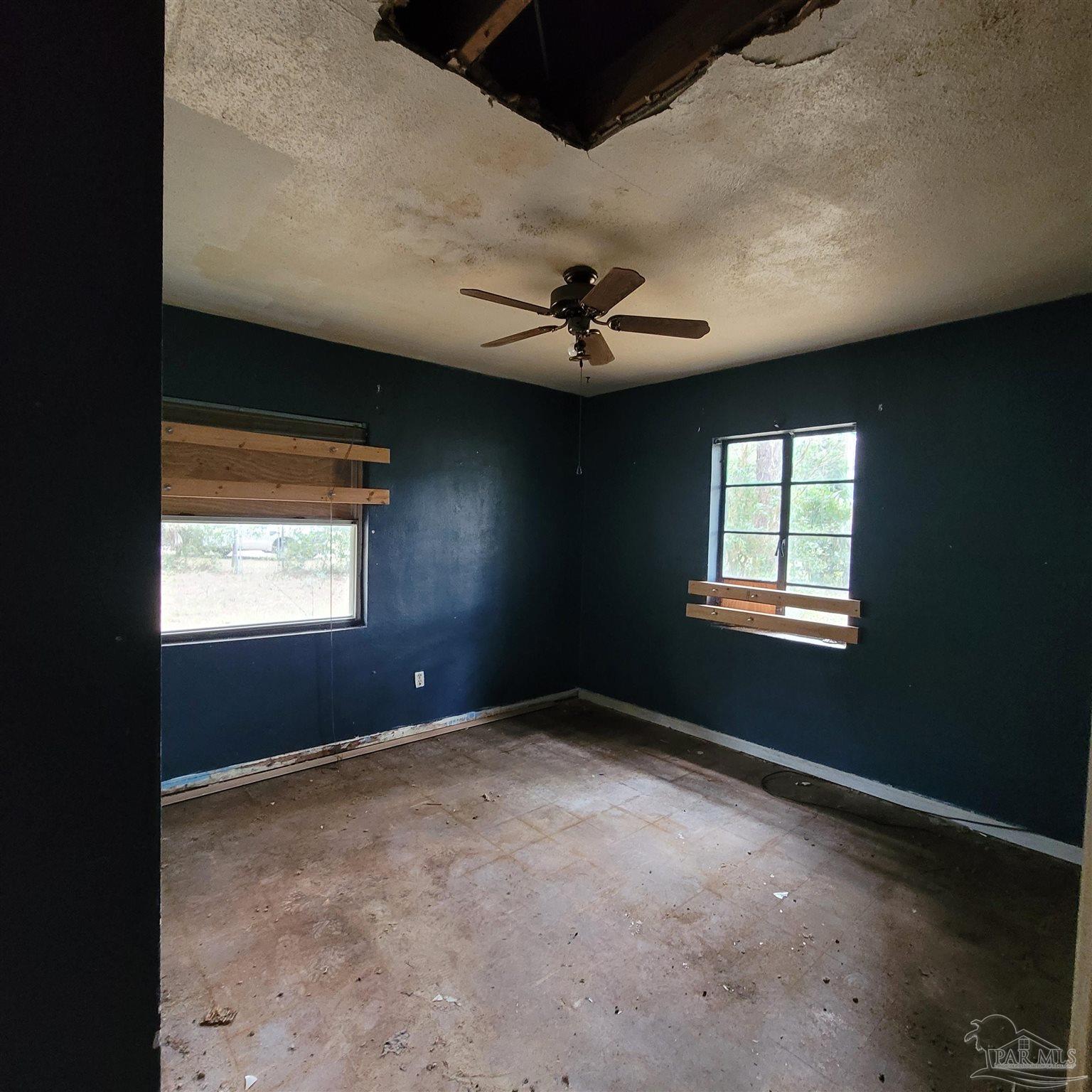 635 Edgewater Drive Pensacola, FL 32507 - Photo 5 of 9 a view of an empty room with a window