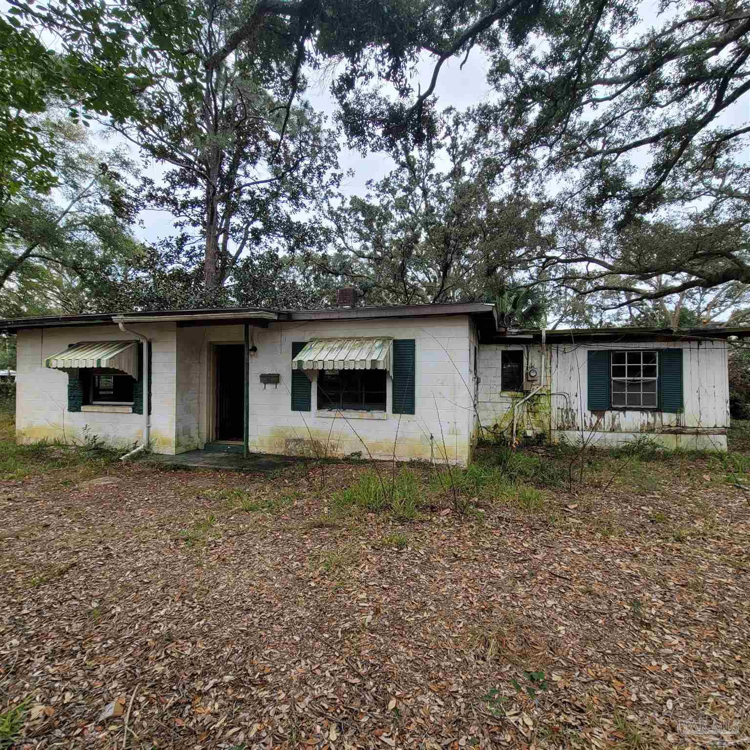 635 Edgewater Drive Pensacola, FL 32507 - Photo 9 of 9 a view of a house with a yard and large tree