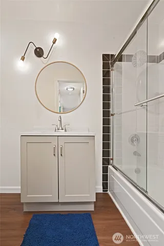 a view of a room with wooden floor and windows