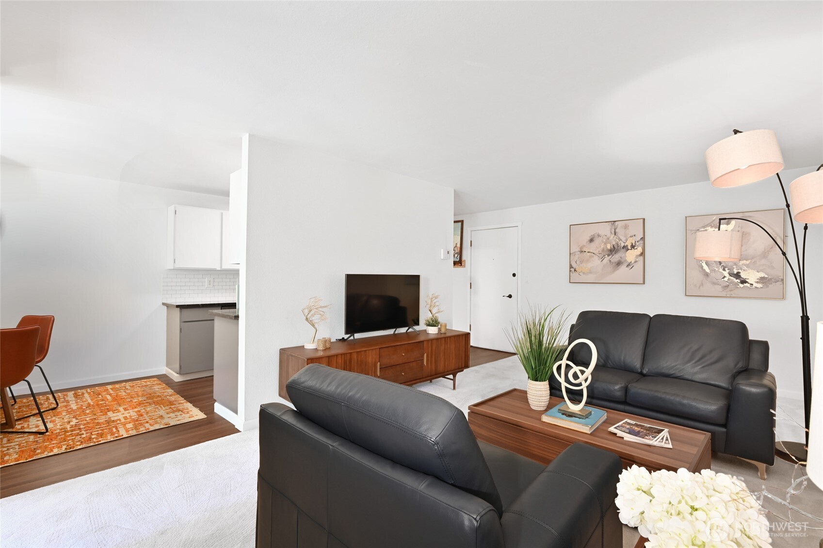 7021 Sand Point Way Northeast, Unit B319 Seattle, WA 98115 - Photo 4 of 29 a living room with furniture and a flat screen tv