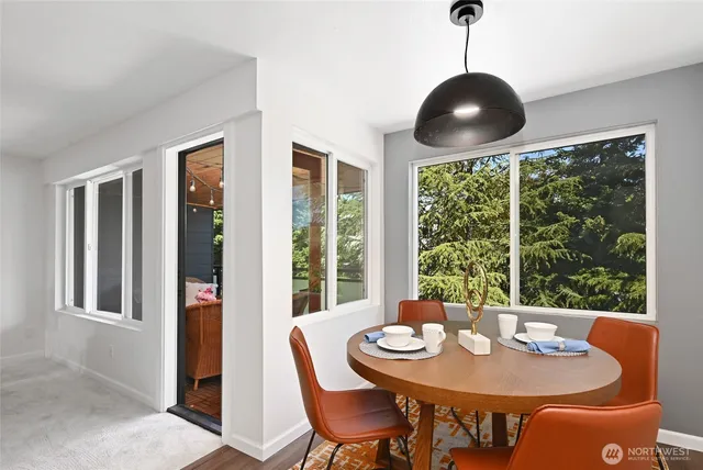 a view of a dining room with furniture window and outside view