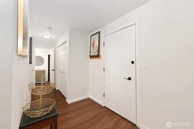 a view of room with wooden floor