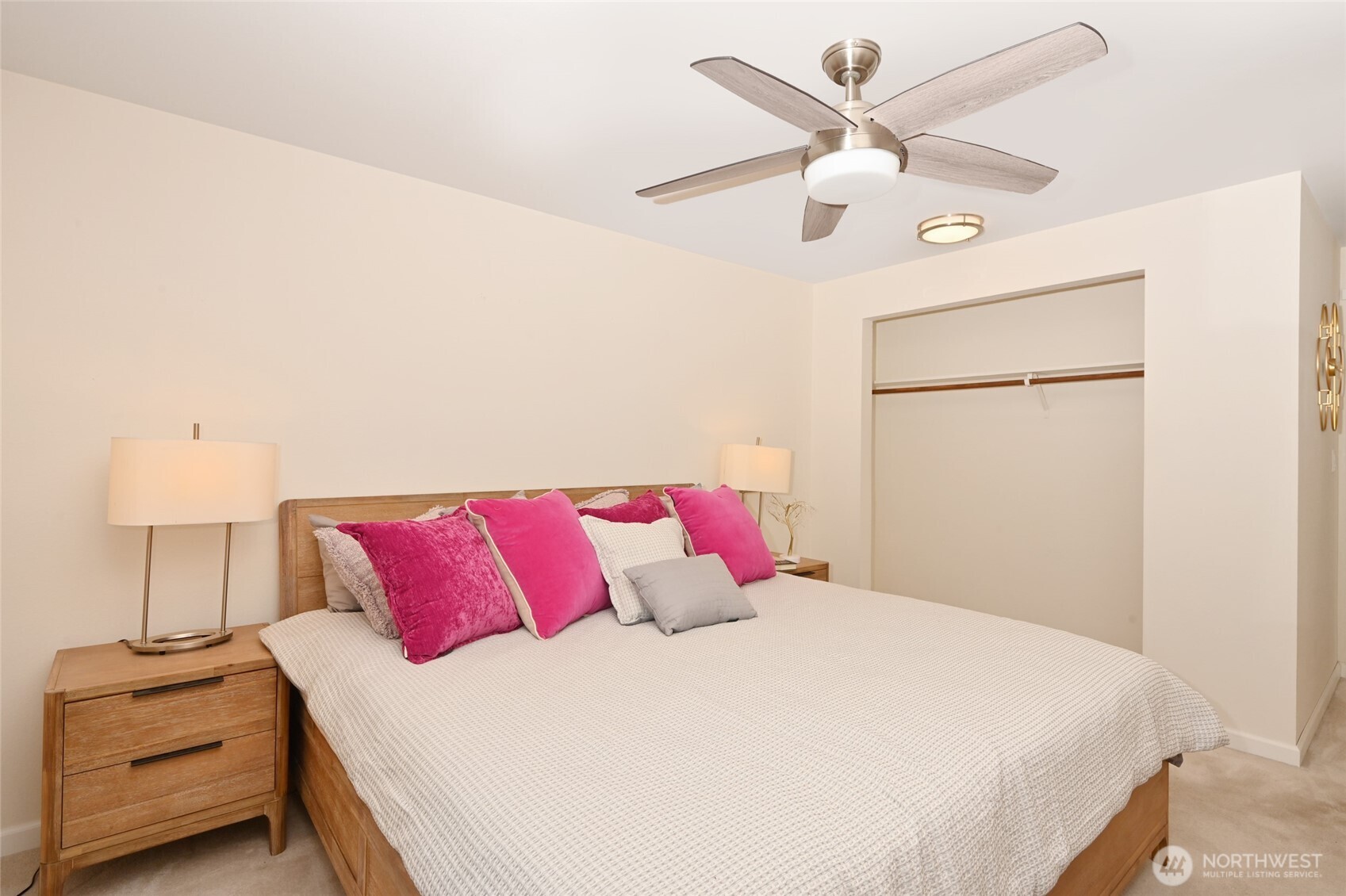 7021 Sand Point Way Northeast, Unit B319 Seattle, WA 98115 - Photo 10 of 29 a bedroom with a bed and a ceiling fan