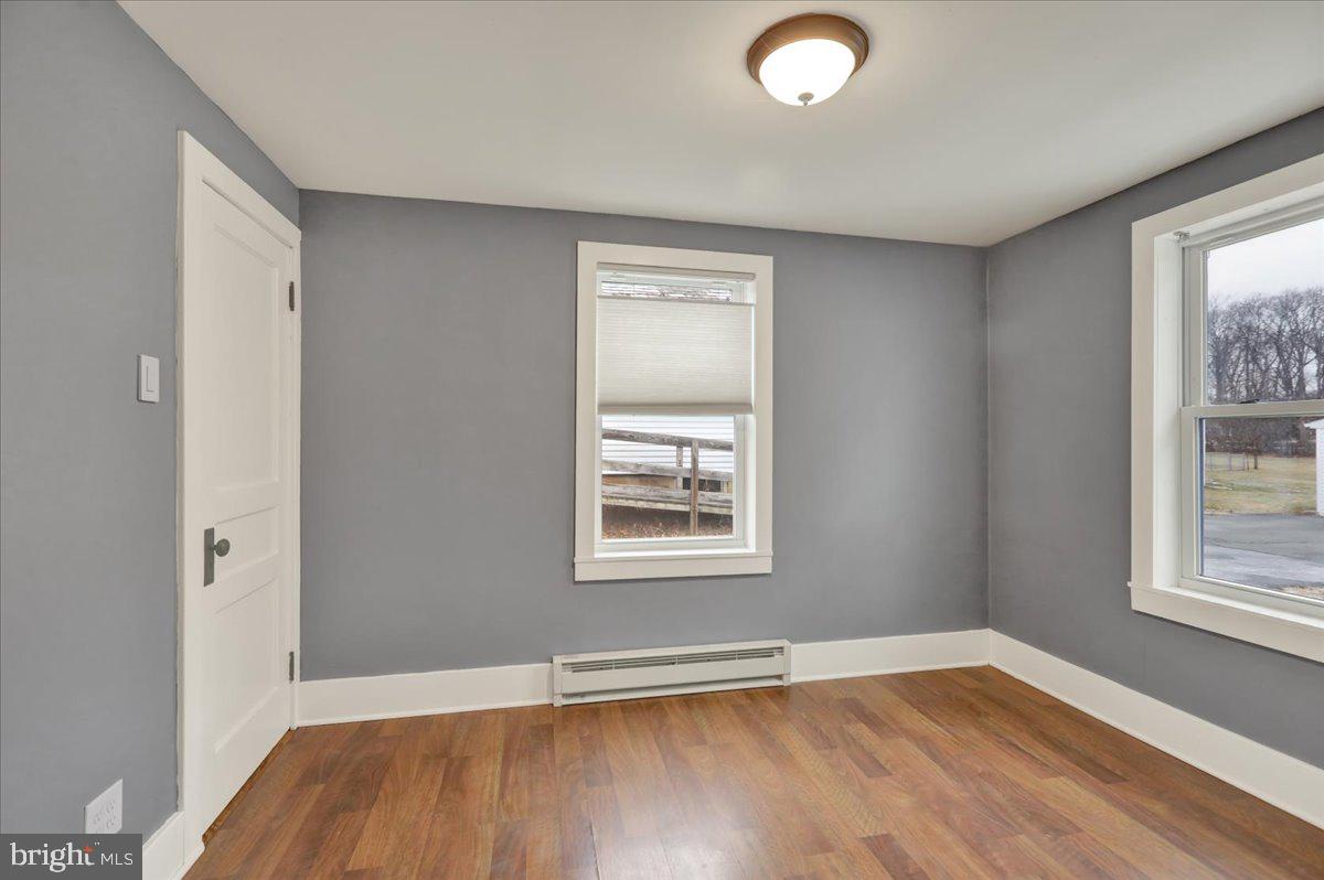 5145 Spruce Road Emmaus, PA 18049 - Photo 11 of 26 an empty room with wooden floor and windows