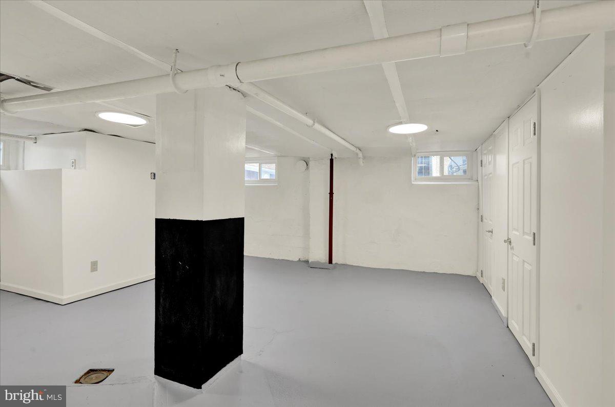 5145 Spruce Road Emmaus, PA 18049 - Photo 18 of 26 a view of hallway with a window and a refrigerator