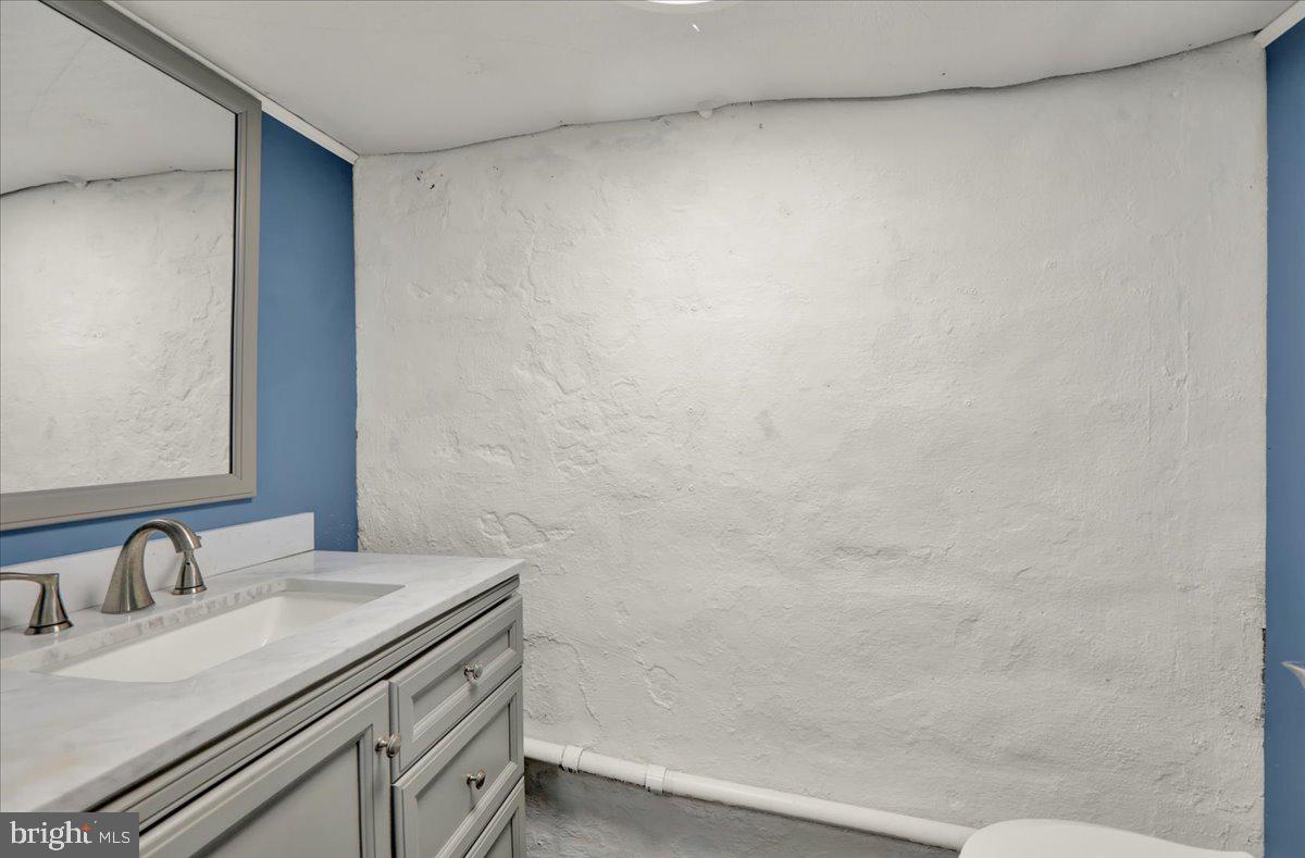 5145 Spruce Road Emmaus, PA 18049 - Photo 19 of 26 a bathroom with a sink and a mirror