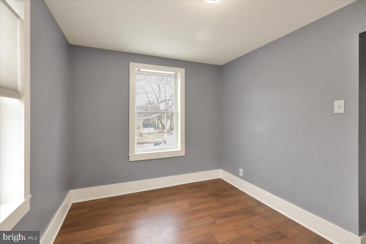 5145 Spruce Road Emmaus, PA 18049 - Photo 10 of 26 an empty room with wooden floor and windows