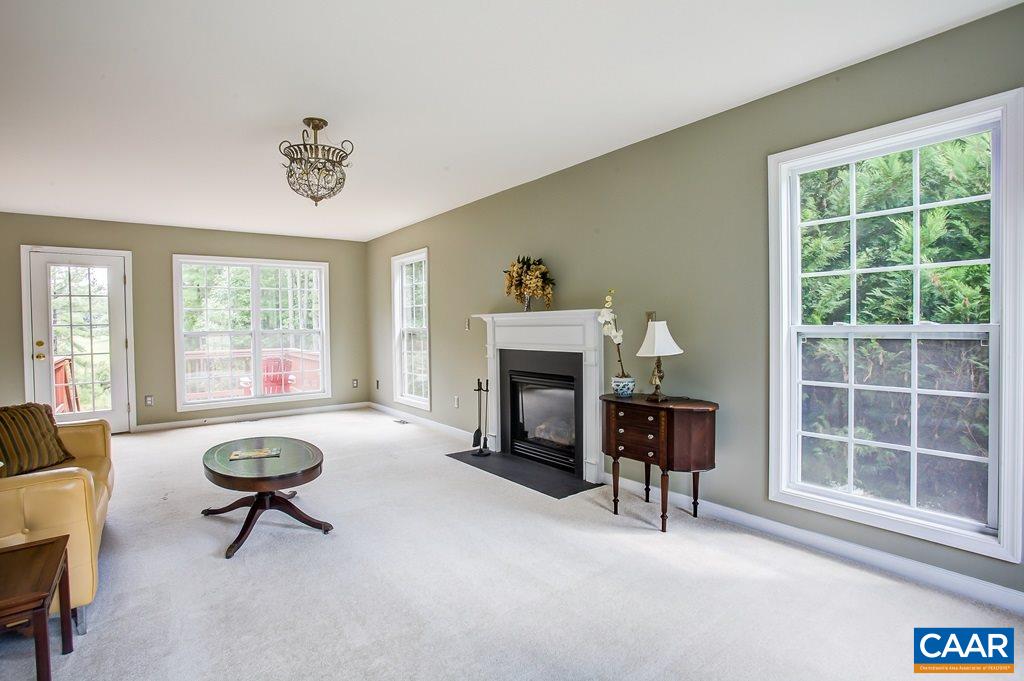 124 Foxmoor Road Troy, VA 22974 - Photo 8 of 35 a living room with furniture a fireplace and window