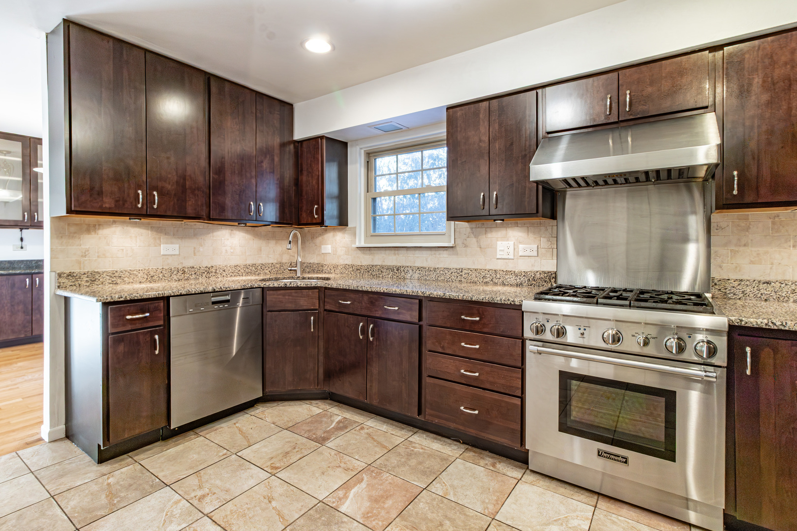 640 Sanders Court Gurnee, IL 60031 - Photo 13 of 38 a kitchen with stainless steel appliances granite countertop a stove and a sink