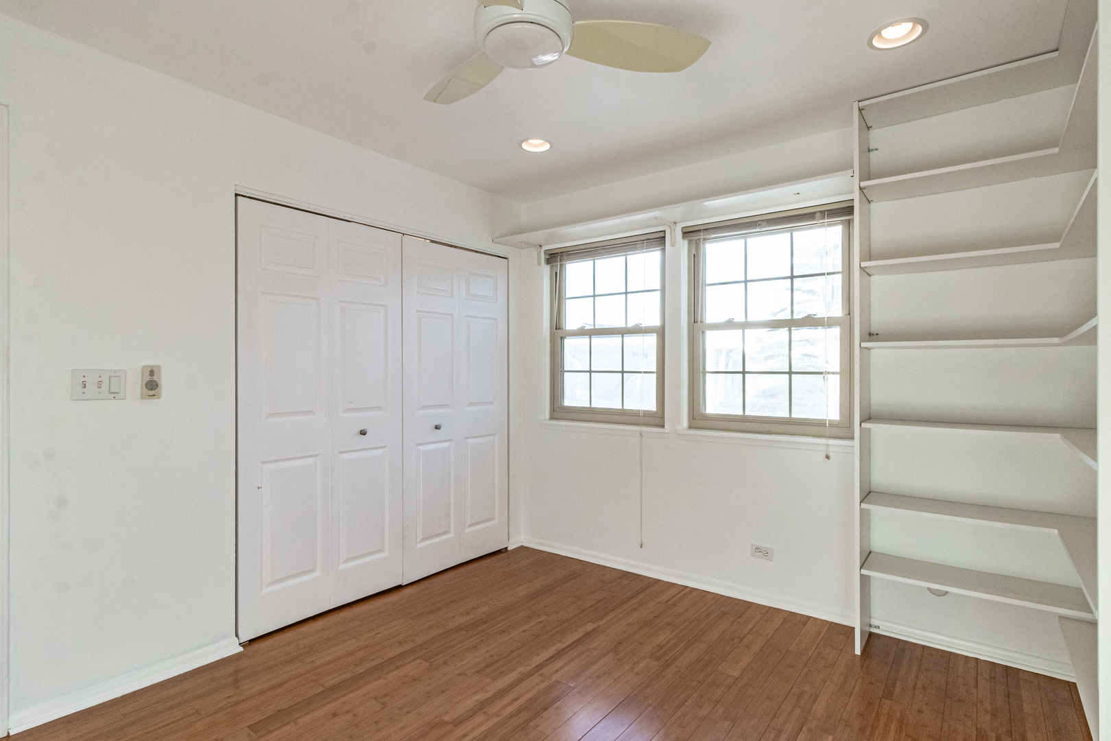 640 Sanders Court Gurnee, IL 60031 - Photo 20 of 38 a view of an empty room with a window and wooden floor