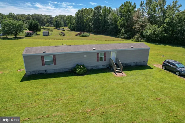 a view of a lake with a yard