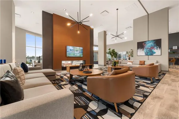 a living room with lots of furniture and a flat screen tv