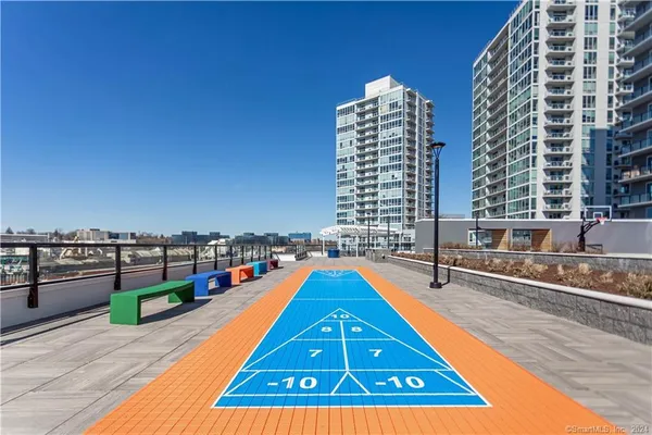 a swimming pool with outdoor seating