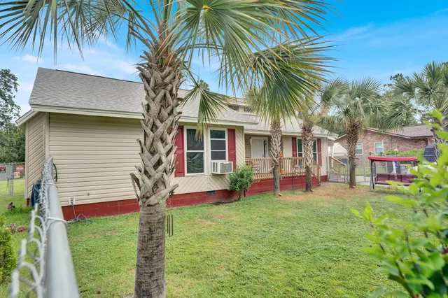 a front view of house with yard and seating area