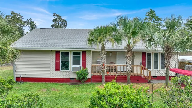 a front view of house with yard and outdoor seating