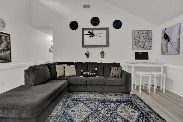 a living room with furniture and a couch