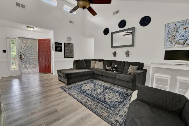 a living room with furniture and a rug