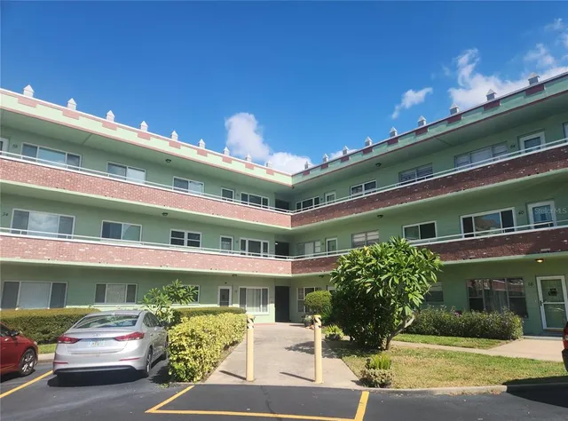 a front view of a building with street view