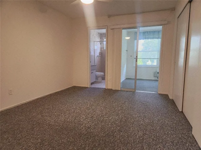 a view of an empty room and closet