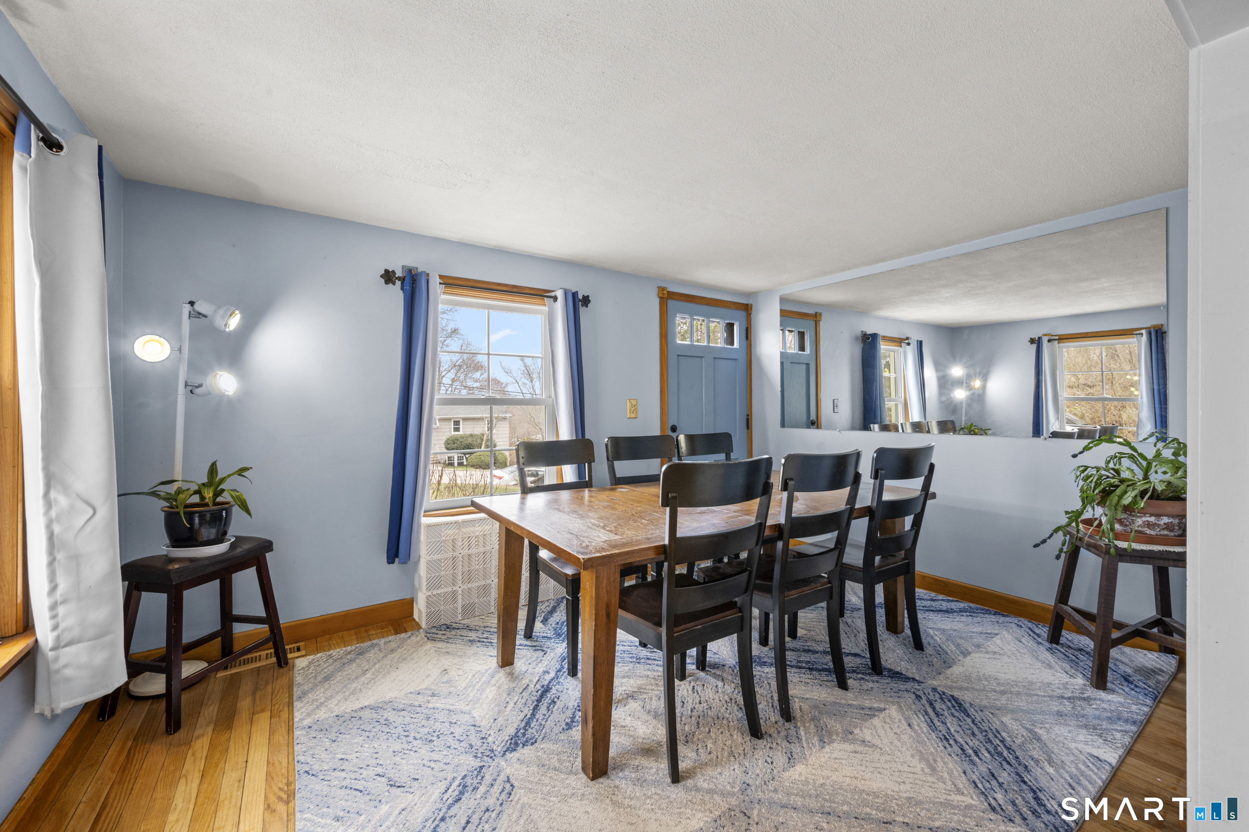26 Field Street Stonington, CT 06379 - Photo 7 of 20 a view of a dining room with furniture and wooden floor