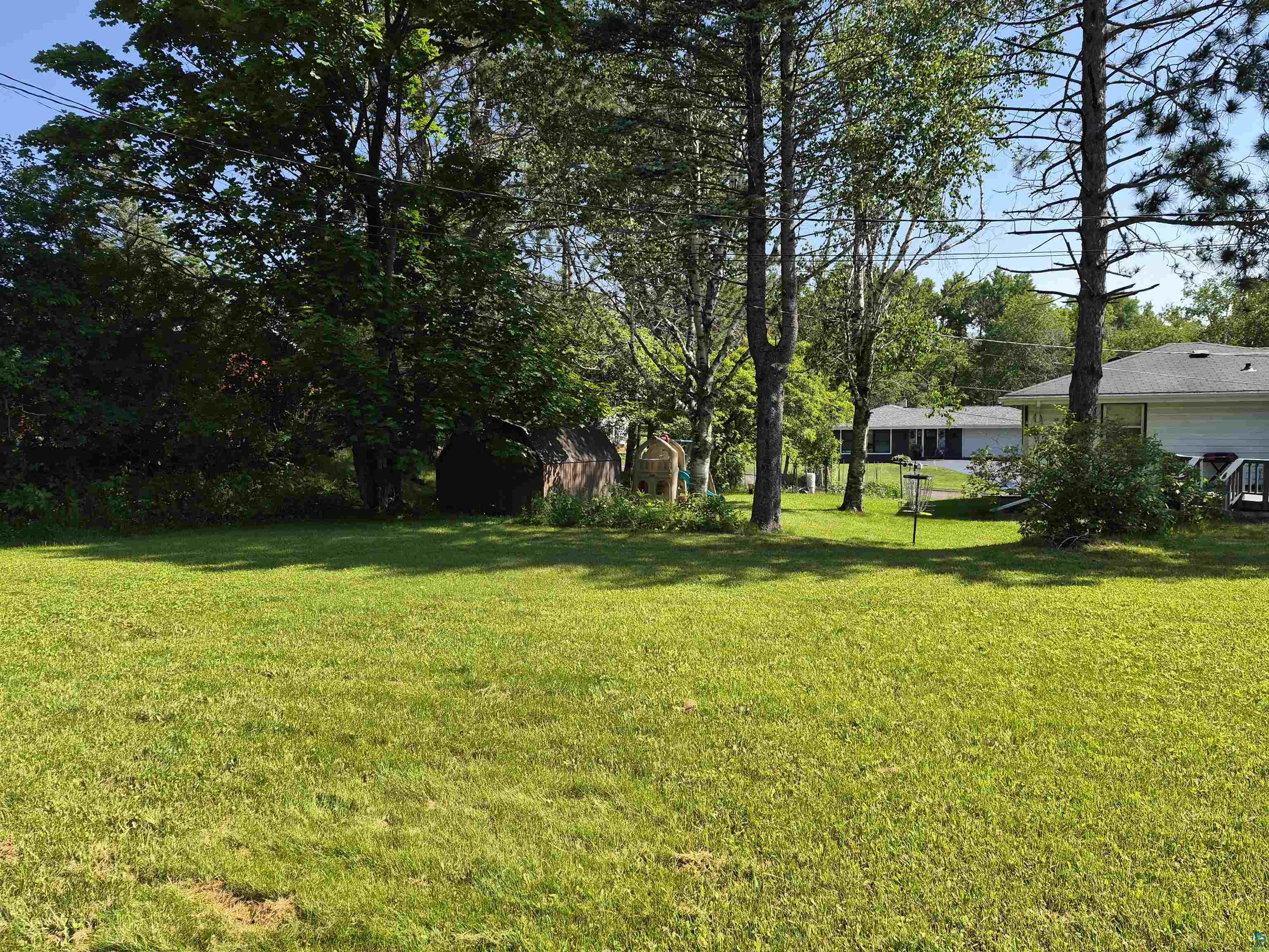 2109 West 22nd Street Duluth, MN 55811 - Photo 6 of 29 Expansive green lawn with mature trees providing partial shade