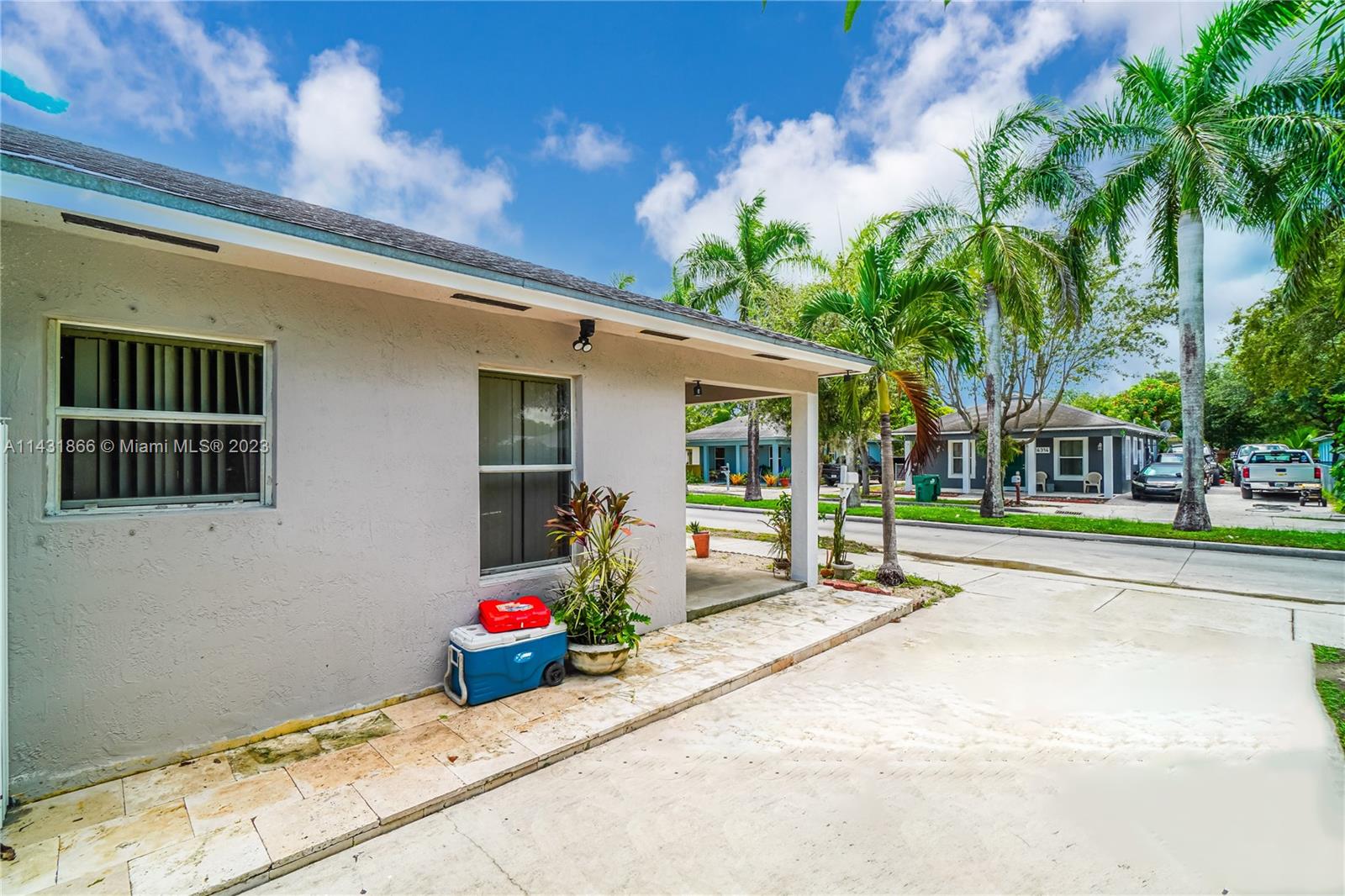 24313 Southwest 130th Avenue Homestead, FL 33032 - Photo 17 of 23 a house view with a sitting space and garden space