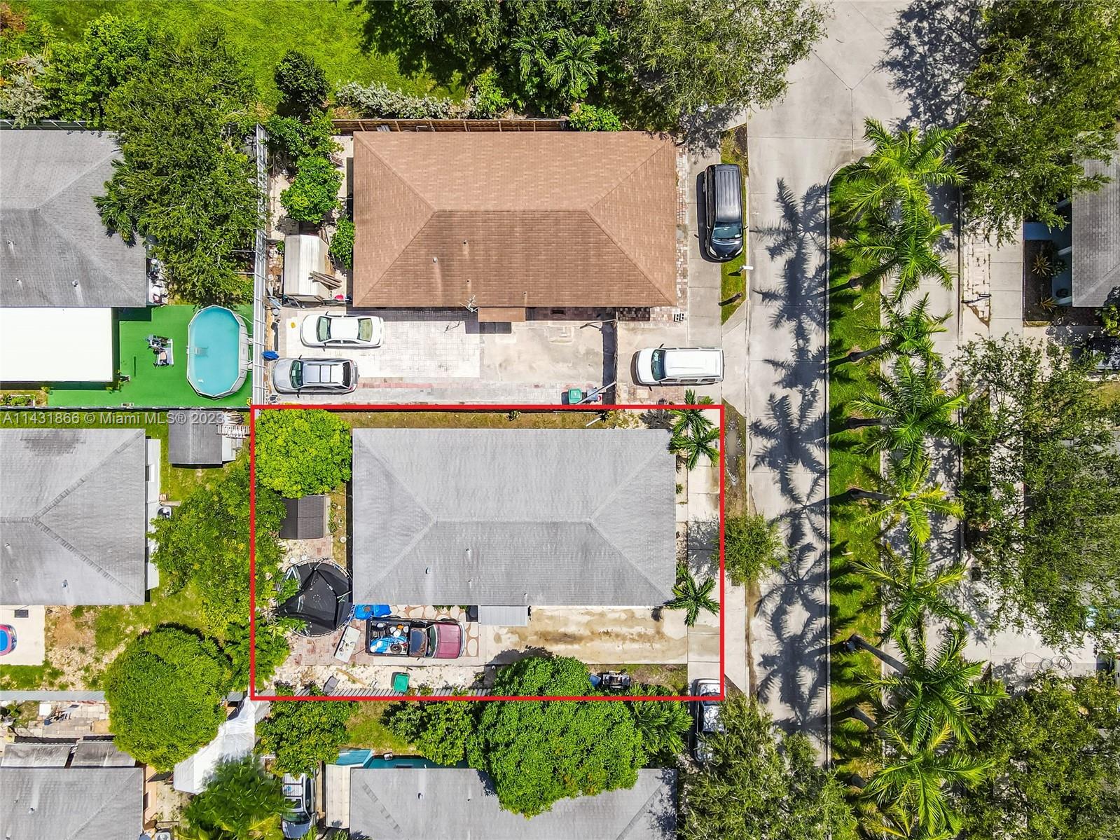 24313 Southwest 130th Avenue Homestead, FL 33032 - Photo 19 of 23 an aerial view of a house with a yard and a large tree
